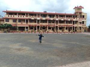 Hunar stands in front of a hotel in Mumbai.